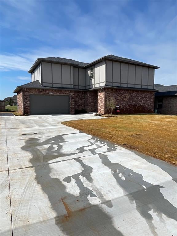 View of front of property featuring concrete drive