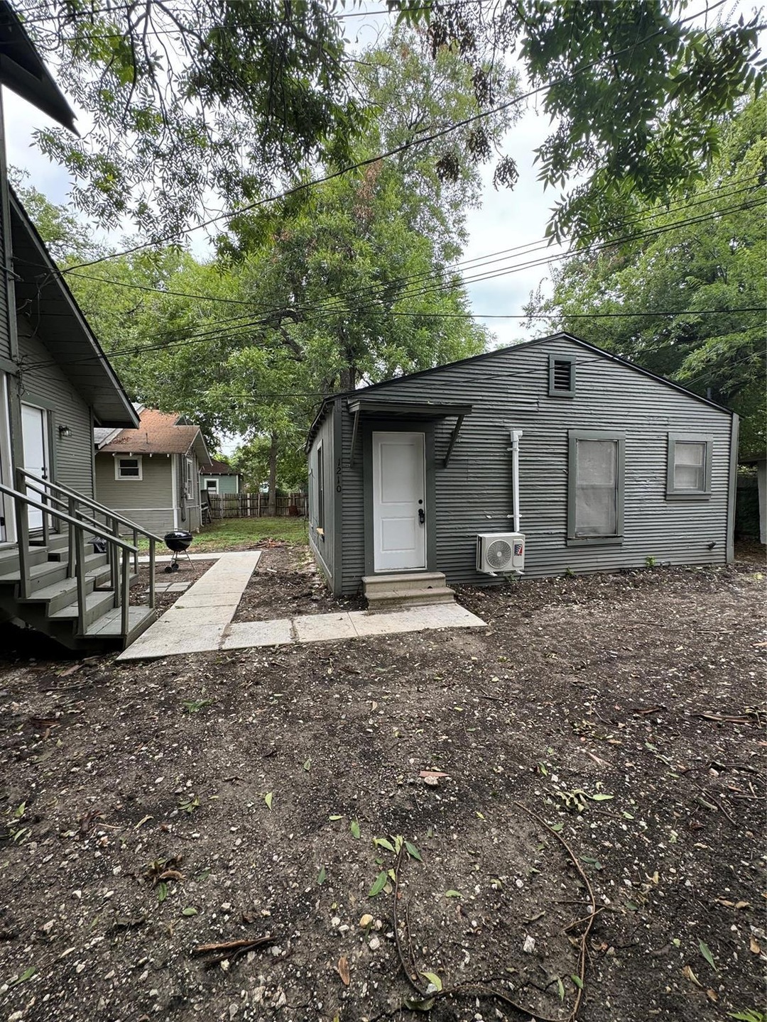 Back of house with ac unit