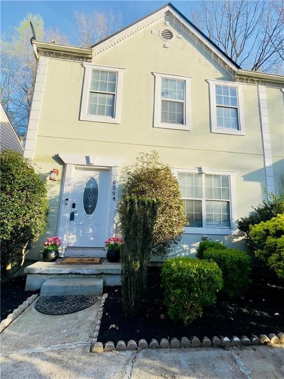 View of front of property featuring stucco siding