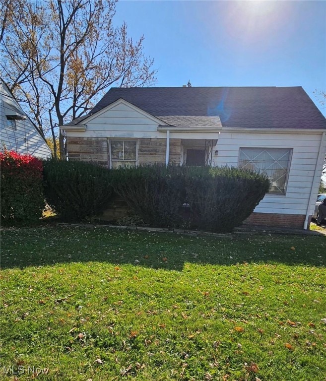 View of front of property with a front yard
