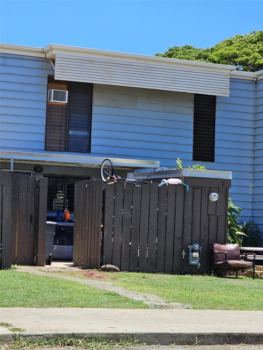 Building front with fenced in yard