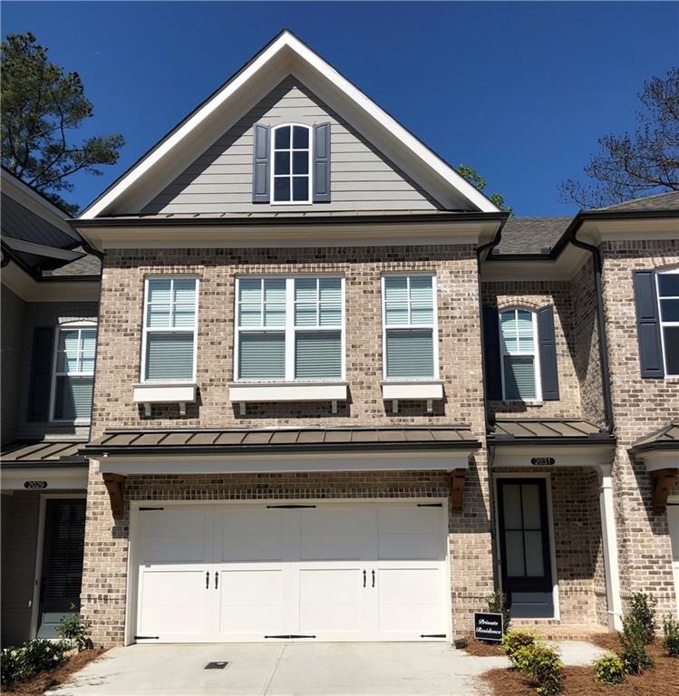 Photo of completed home with same elevation.