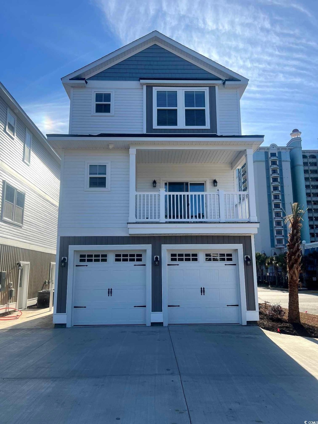 View of front of home featuring a garage and driveway
