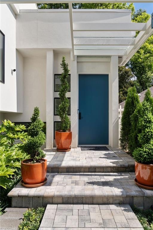 As you walk up the main path from the street, you'll notice the front patio above the garage - it offers some amazing views and fantastic privacy.