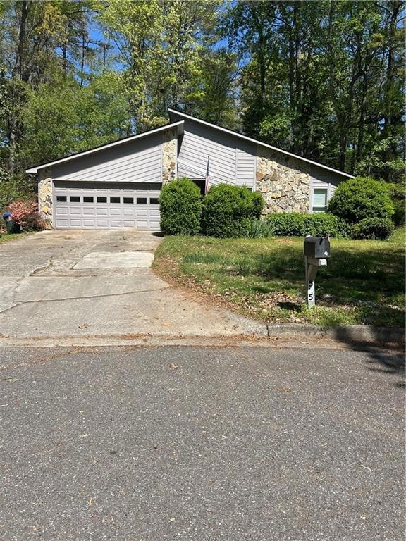 View of home's exterior with an attached garage, c