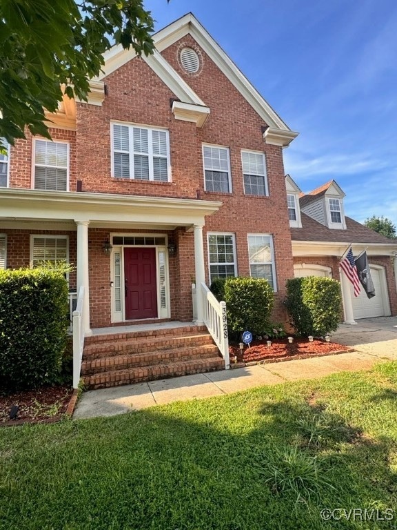 View of front of house with brick siding, a front