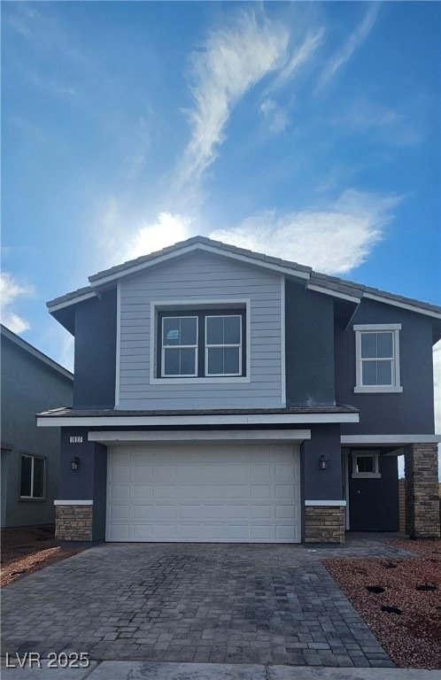 View of front facade with stone siding, decorative