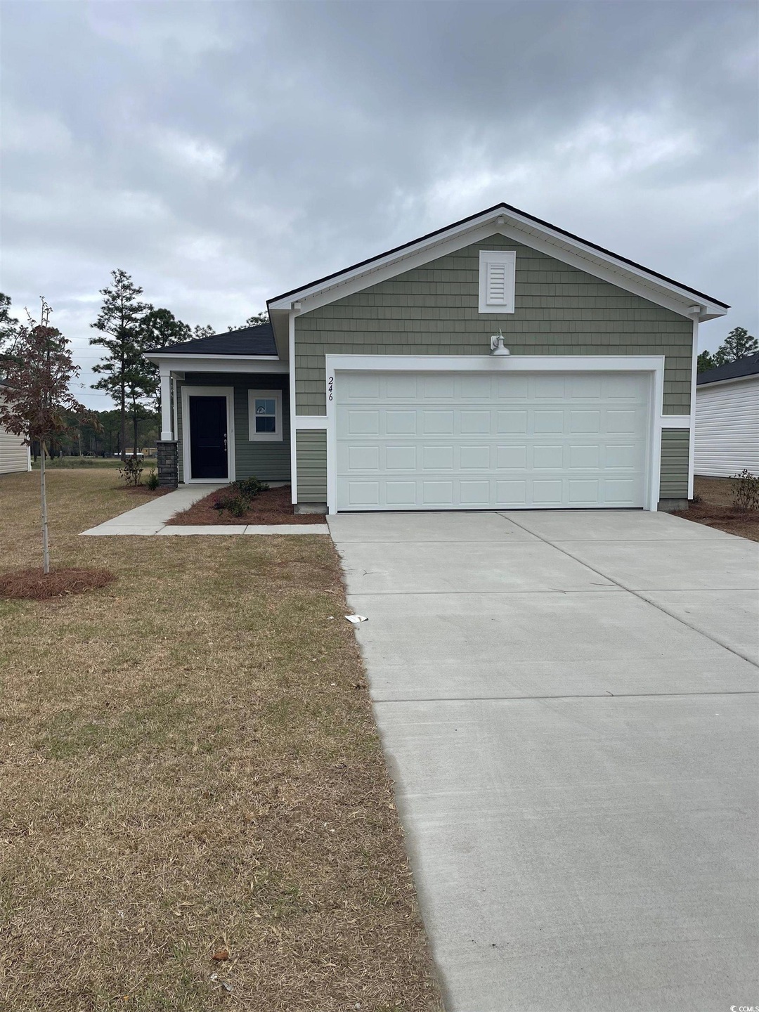 View of front of home with a front lawn, an attach