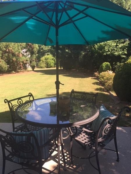 VIEW OF DEEP BACK YARD AS SEEN FROM THE HOME AND PATIO
