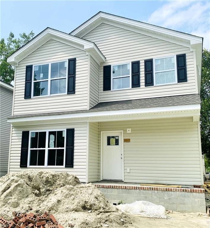Exterior front of a similar model. Siding is grey.