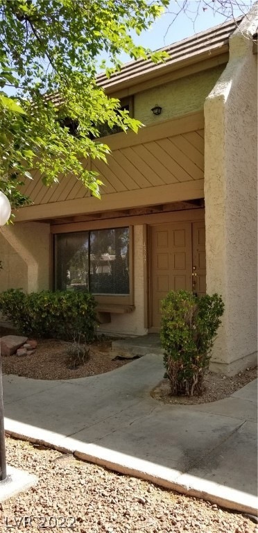 Double door entrance and balcony facing pool and g