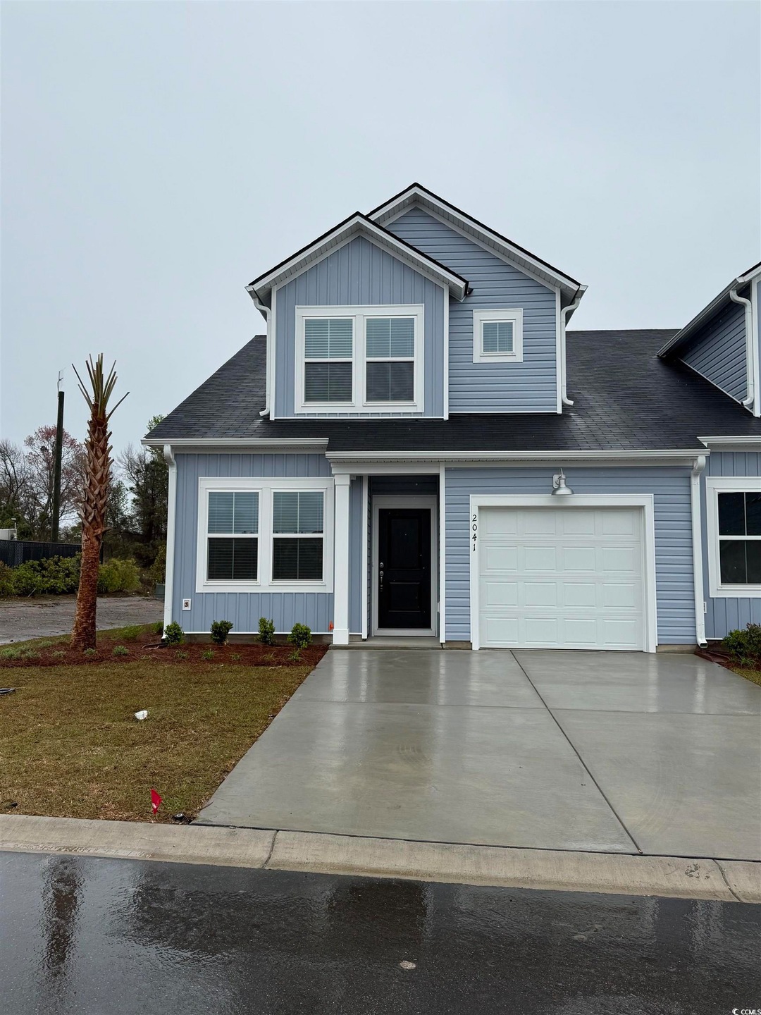Traditional-style home with an attached garage and