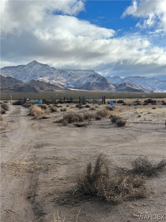 Property view of mountains with a rural view
