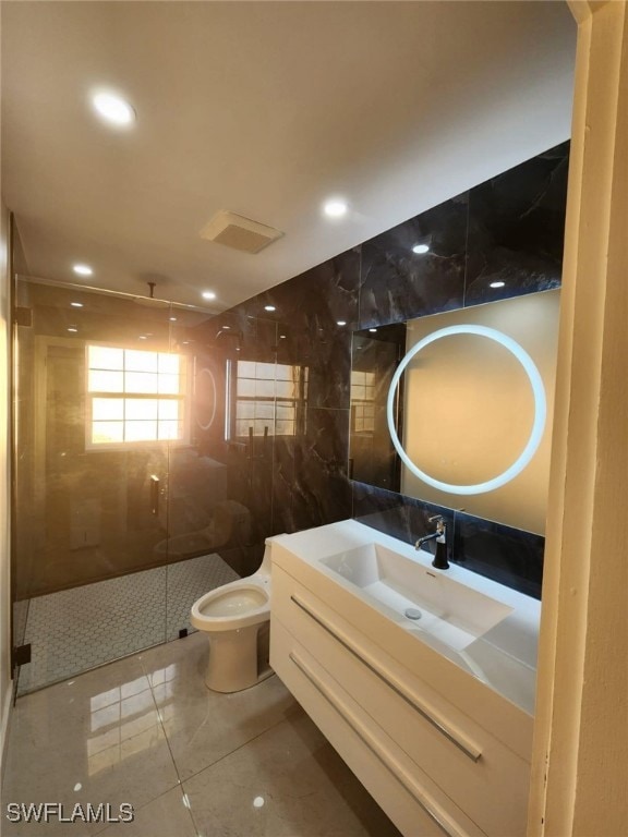 Bathroom with tile patterned floors, toilet, tile