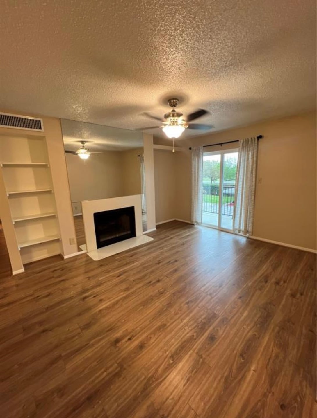 This inviting living room features warm wood floor