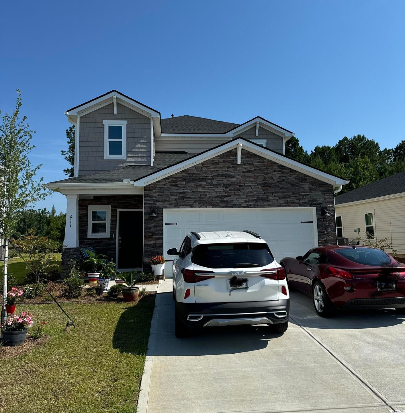 View of front of house featuring a garage and a fr