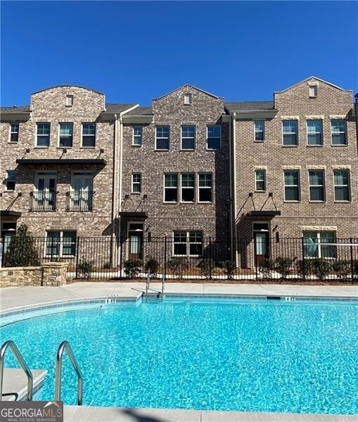 View of front of home from the community pool.