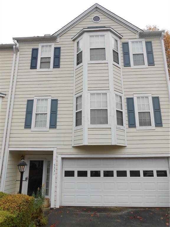 View of home's exterior with a garage