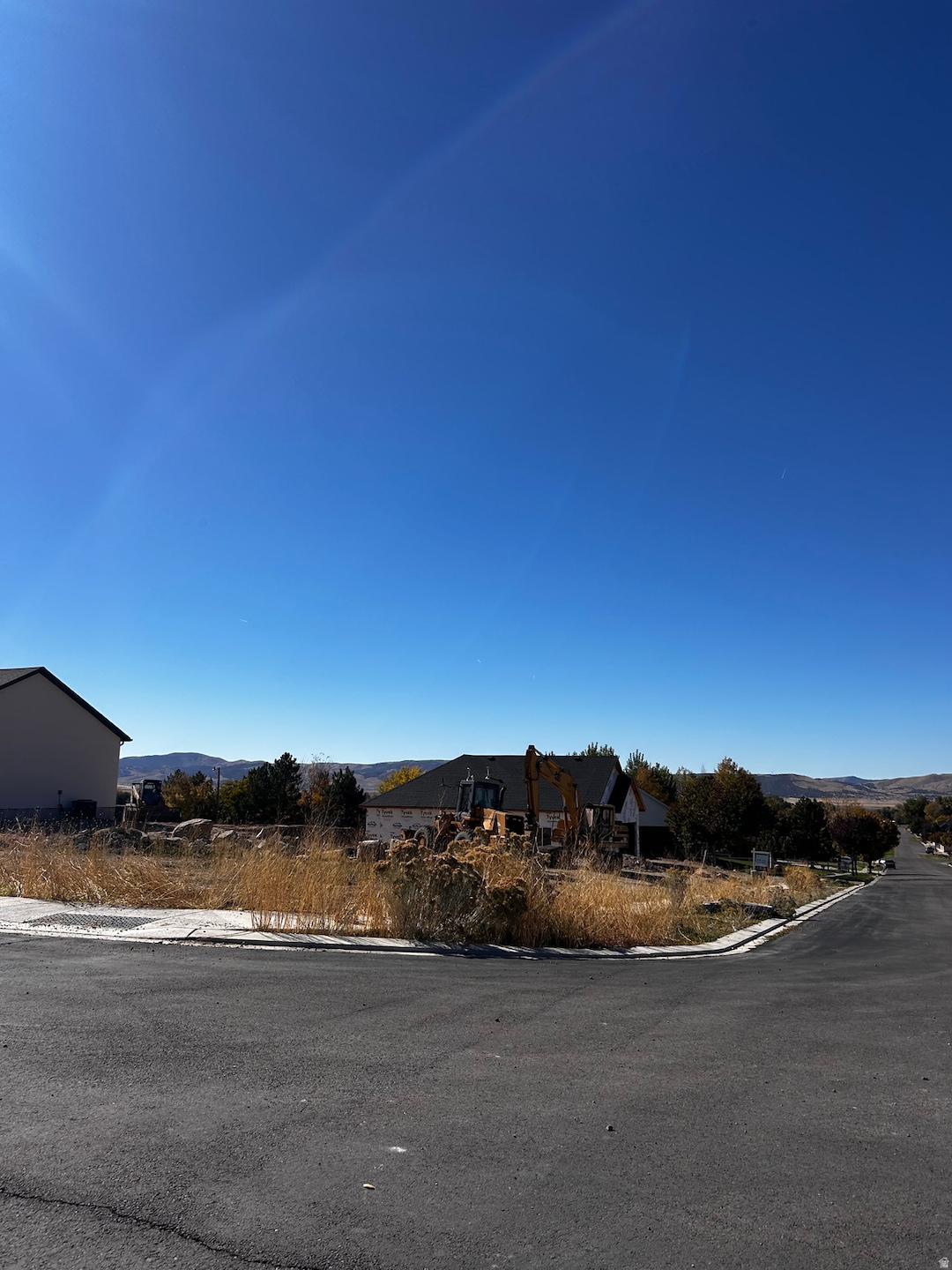 Featuring a mountain view and curbs