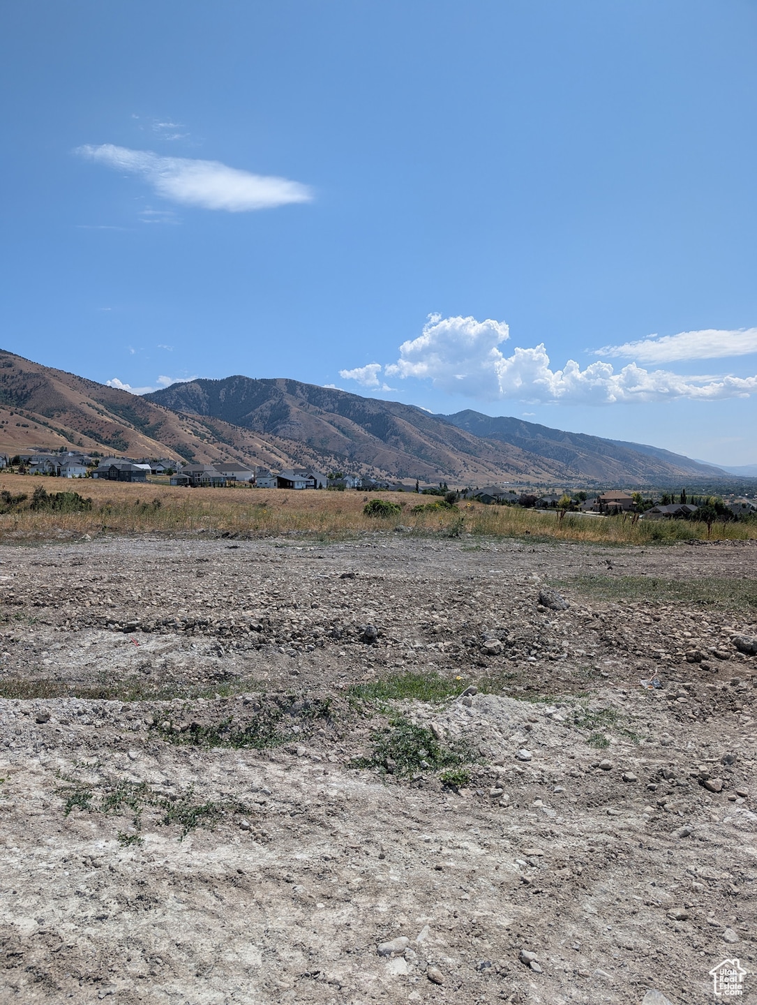 View of mountain background featuring rural landscape