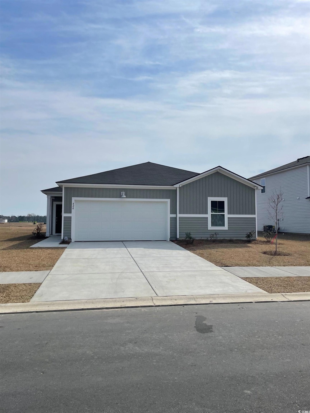 View of front facade featuring an attached garage,
