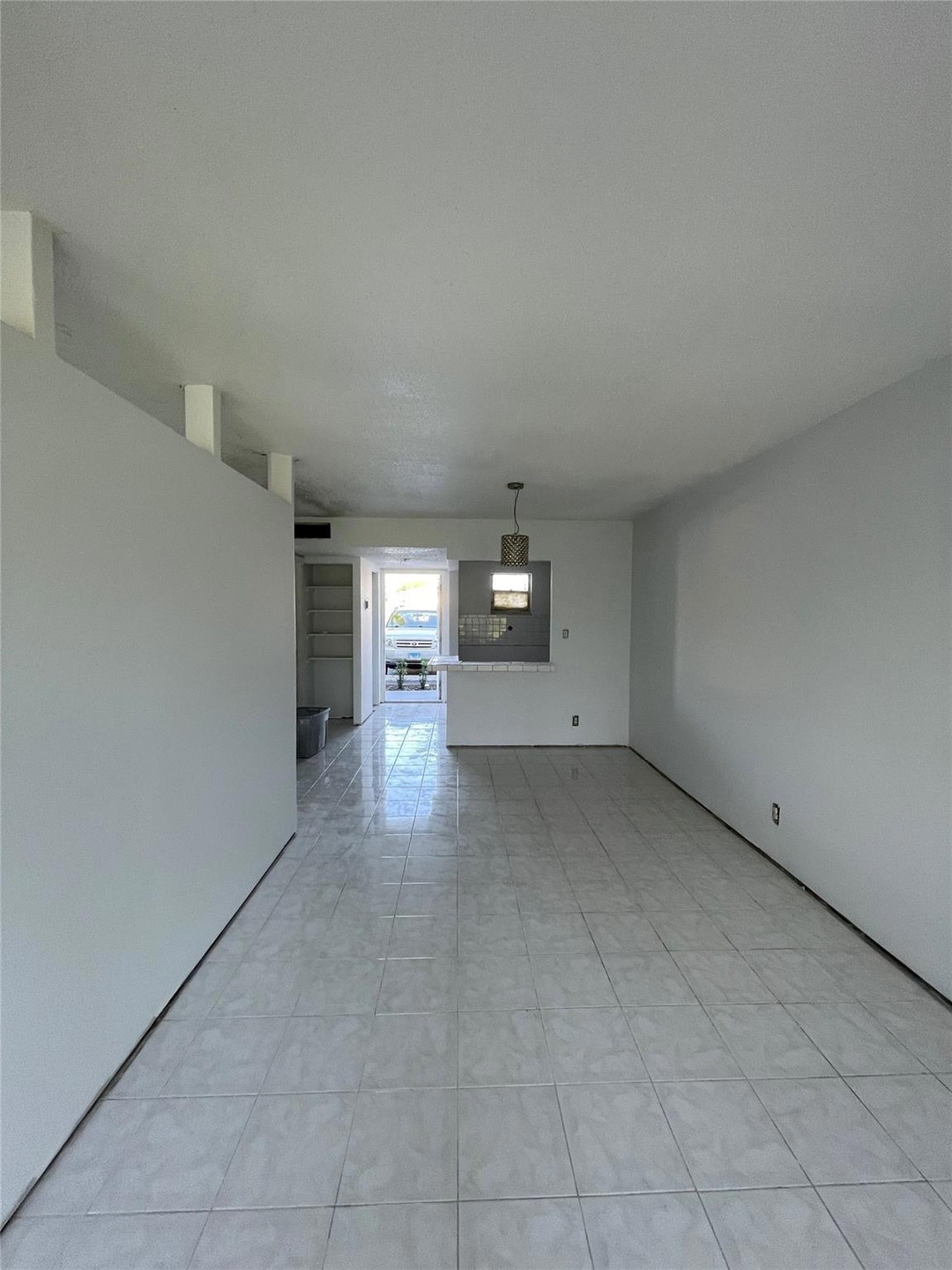 Living room toward Kitchen and Front door