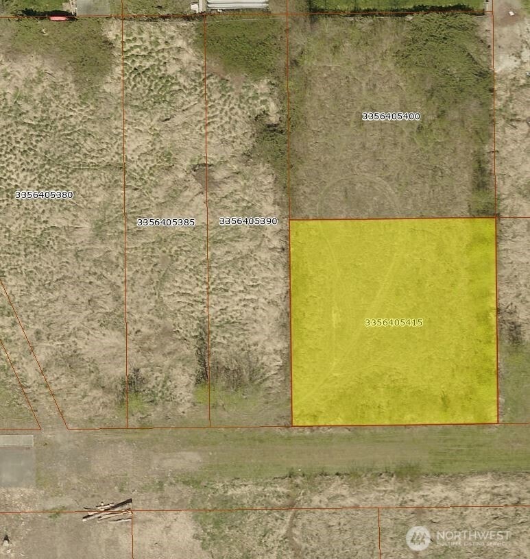 Note driveway punched into the property which sits up from the neighboring land.