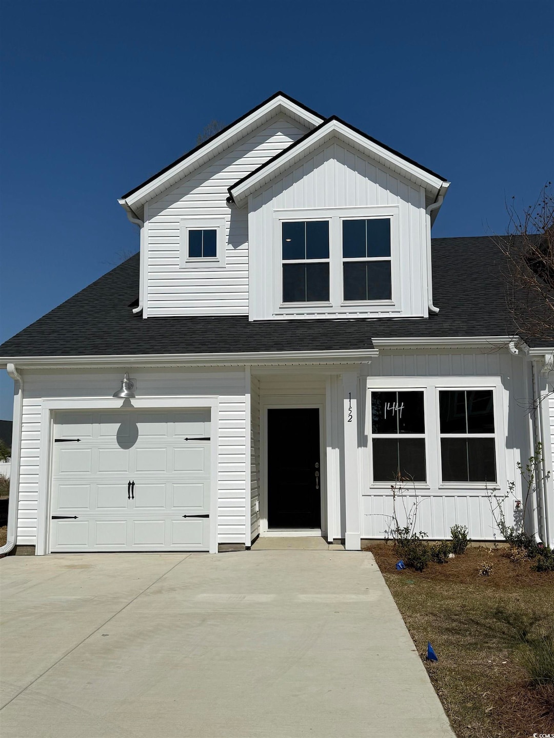 View of front of house featuring roof with shingle