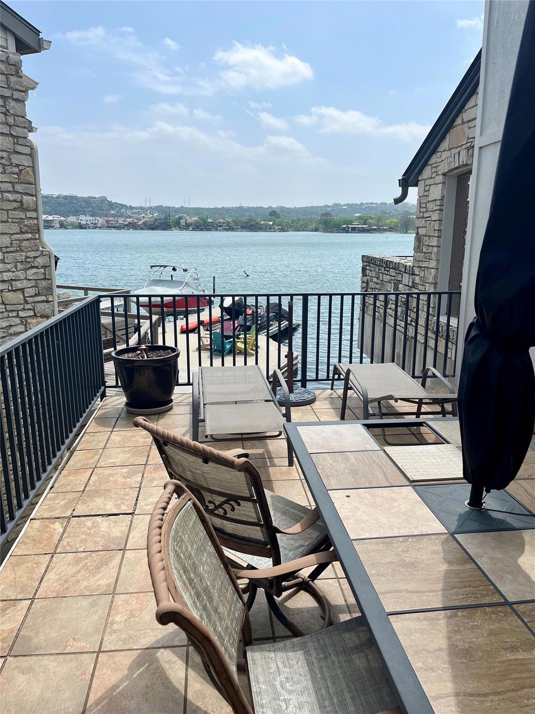 View of patio / terrace featuring a water view an