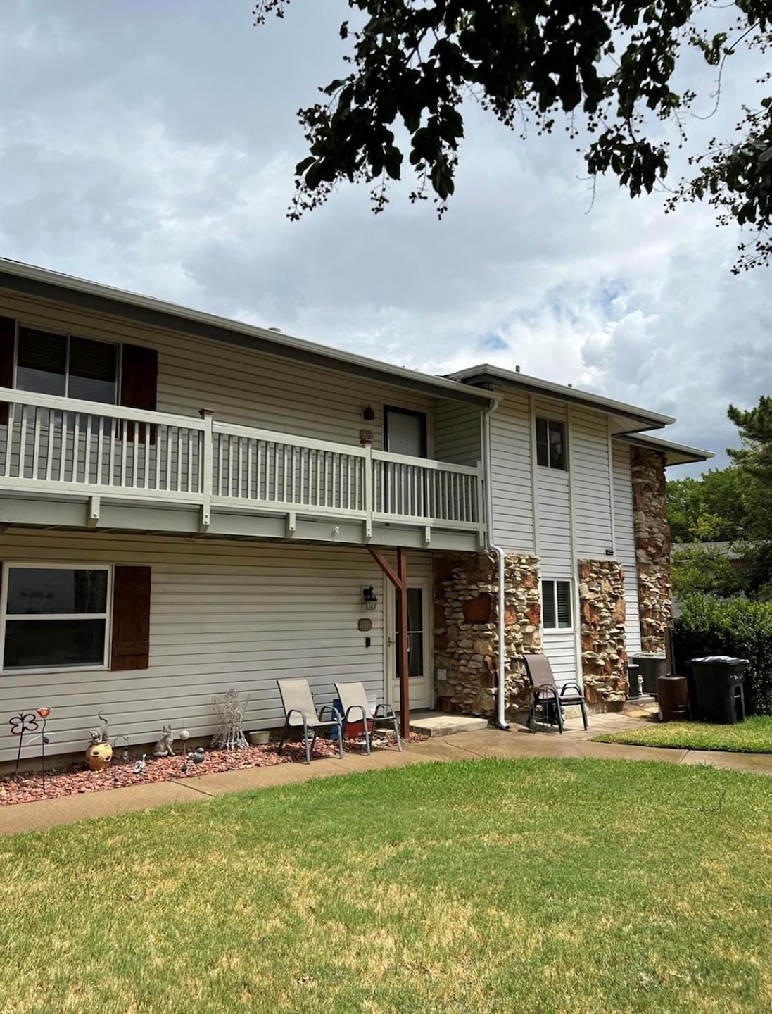 Back of house featuring a patio area, a yard, and 
