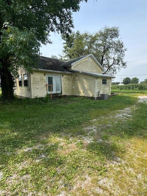 View of home's exterior with a lawn