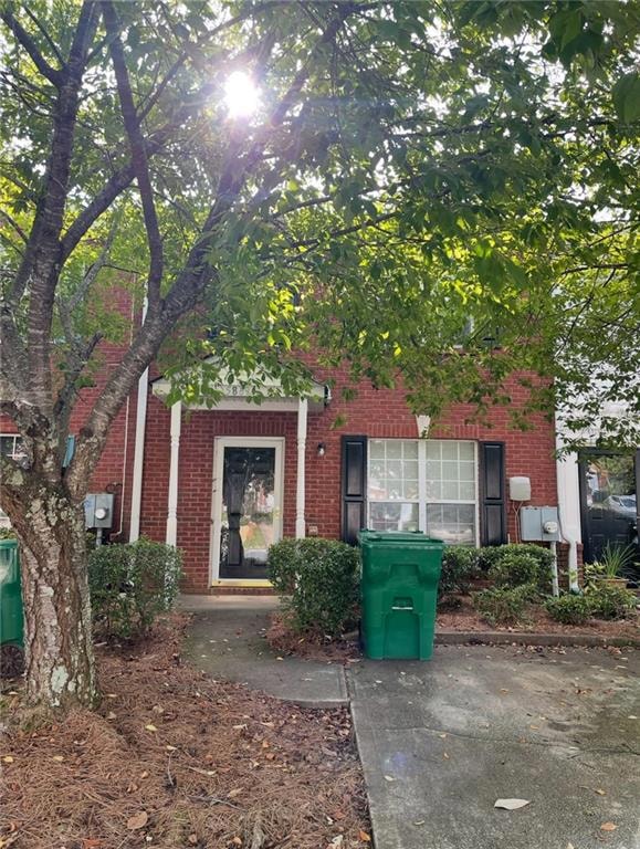 View of exterior entry with brick siding
