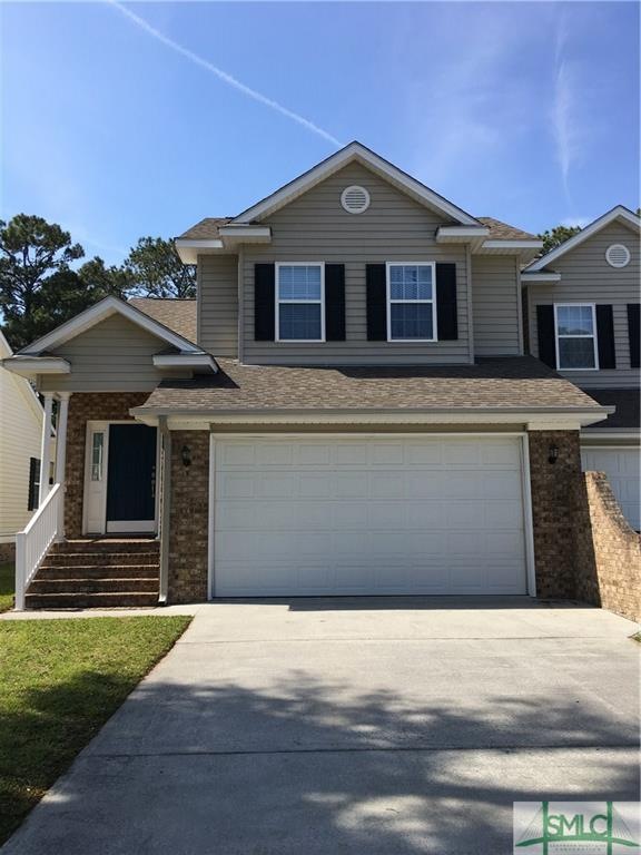 2 story brick front townhome with 2 car garage