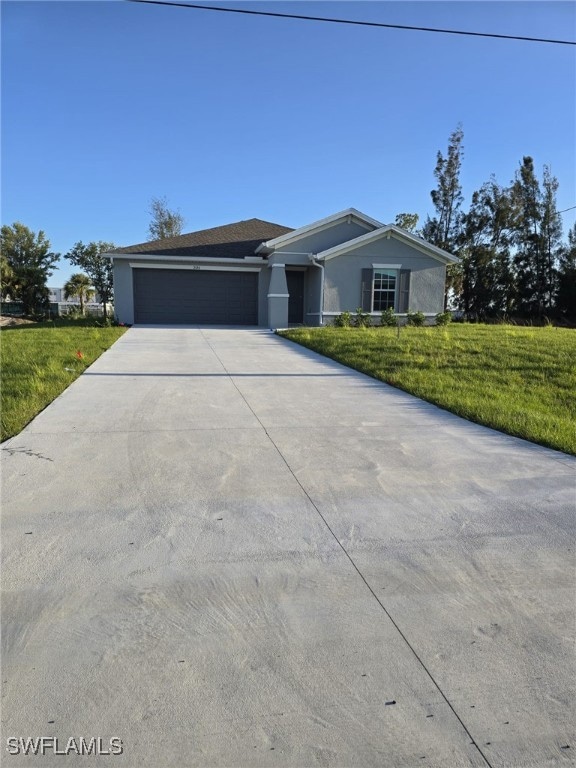 View of front of property featuring concrete drive