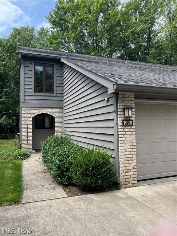 View of front of property featuring a garage