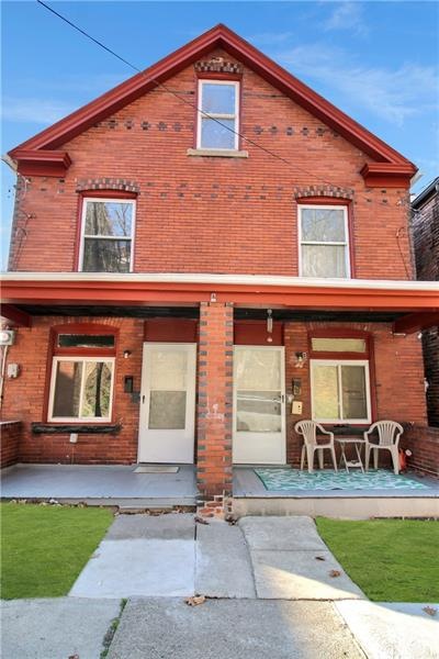 Solid duplex with covered front porches and tons o