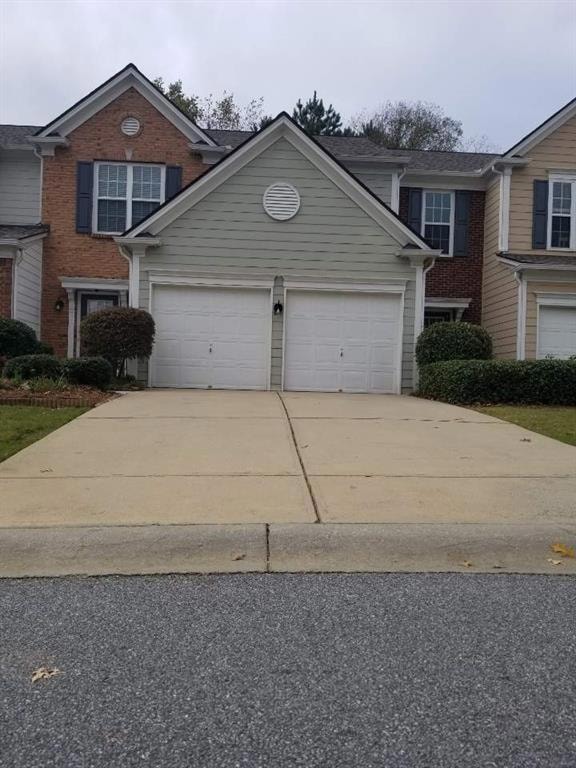 View of front of home featuring a garage