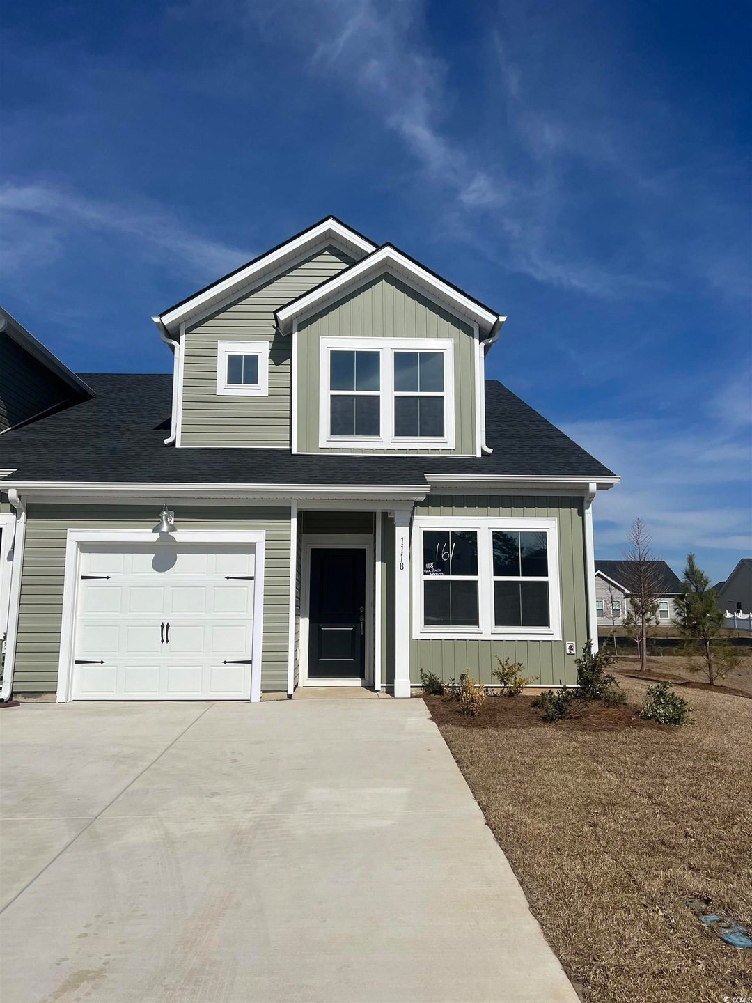 View of front of home featuring a garage, driveway