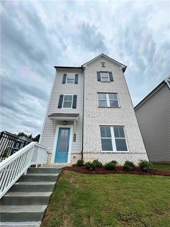 View of front of house with a front lawn