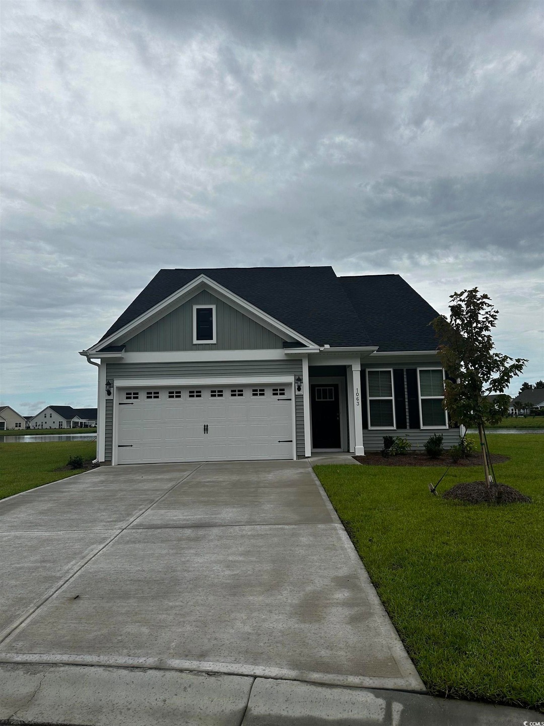 View of front of home featuring a garage and a fro