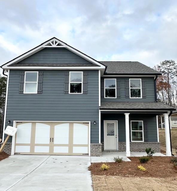 View of front of property with covered porch and a