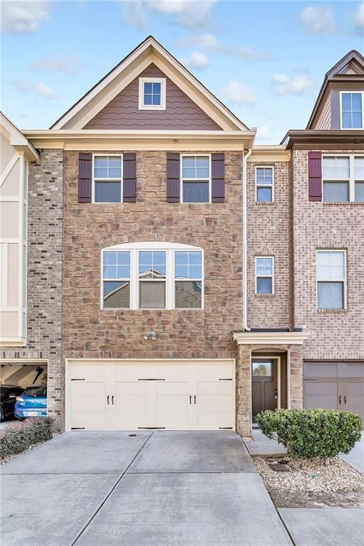 View of property with a two-car garage