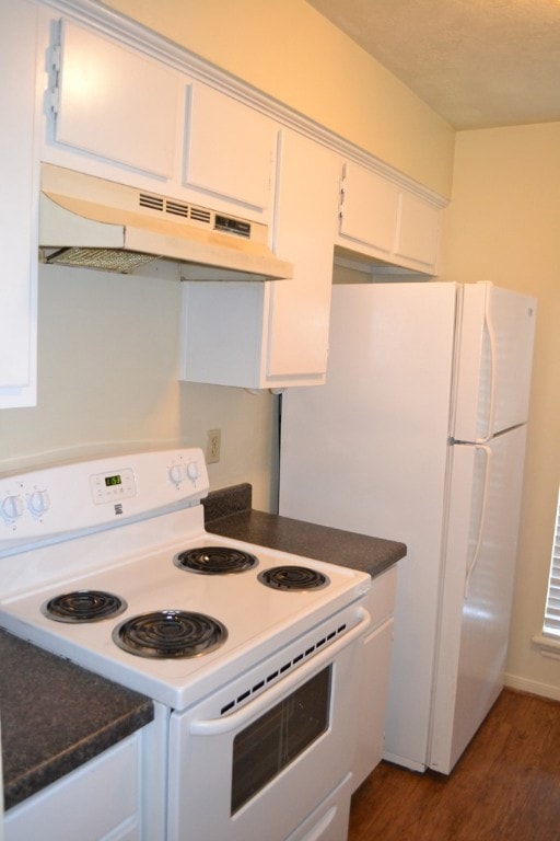 Kitchen featuring dark countertops, under cabinet