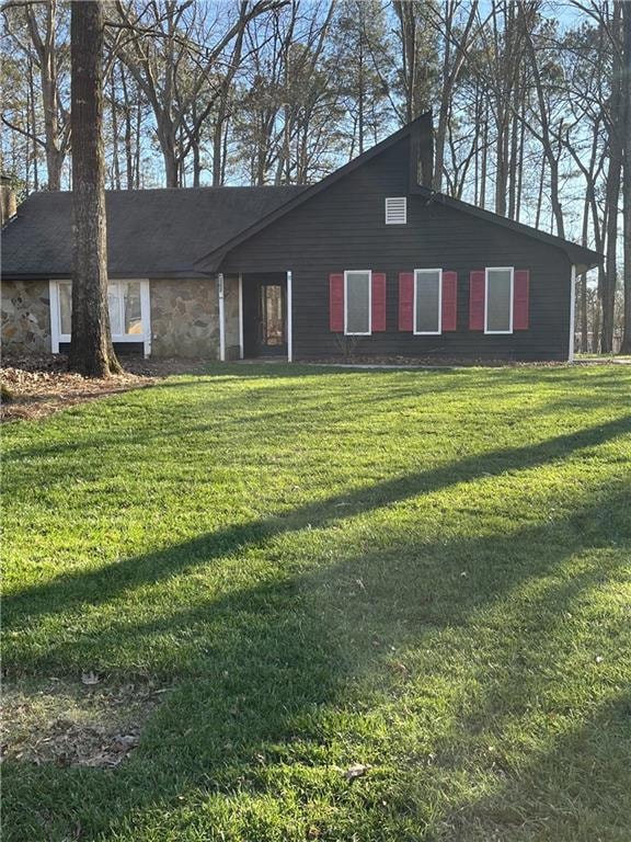 View of front of house with a front lawn