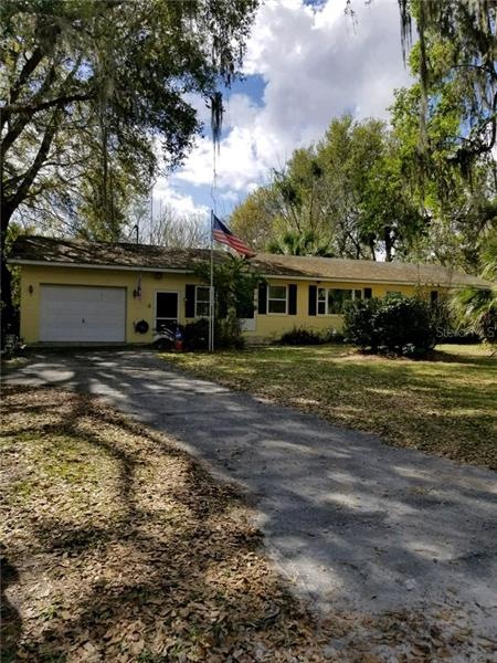 Front with paved driveway
