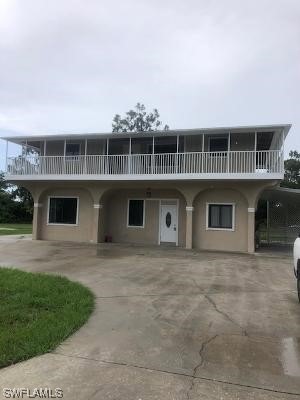 Wrap around porch with circular driveway