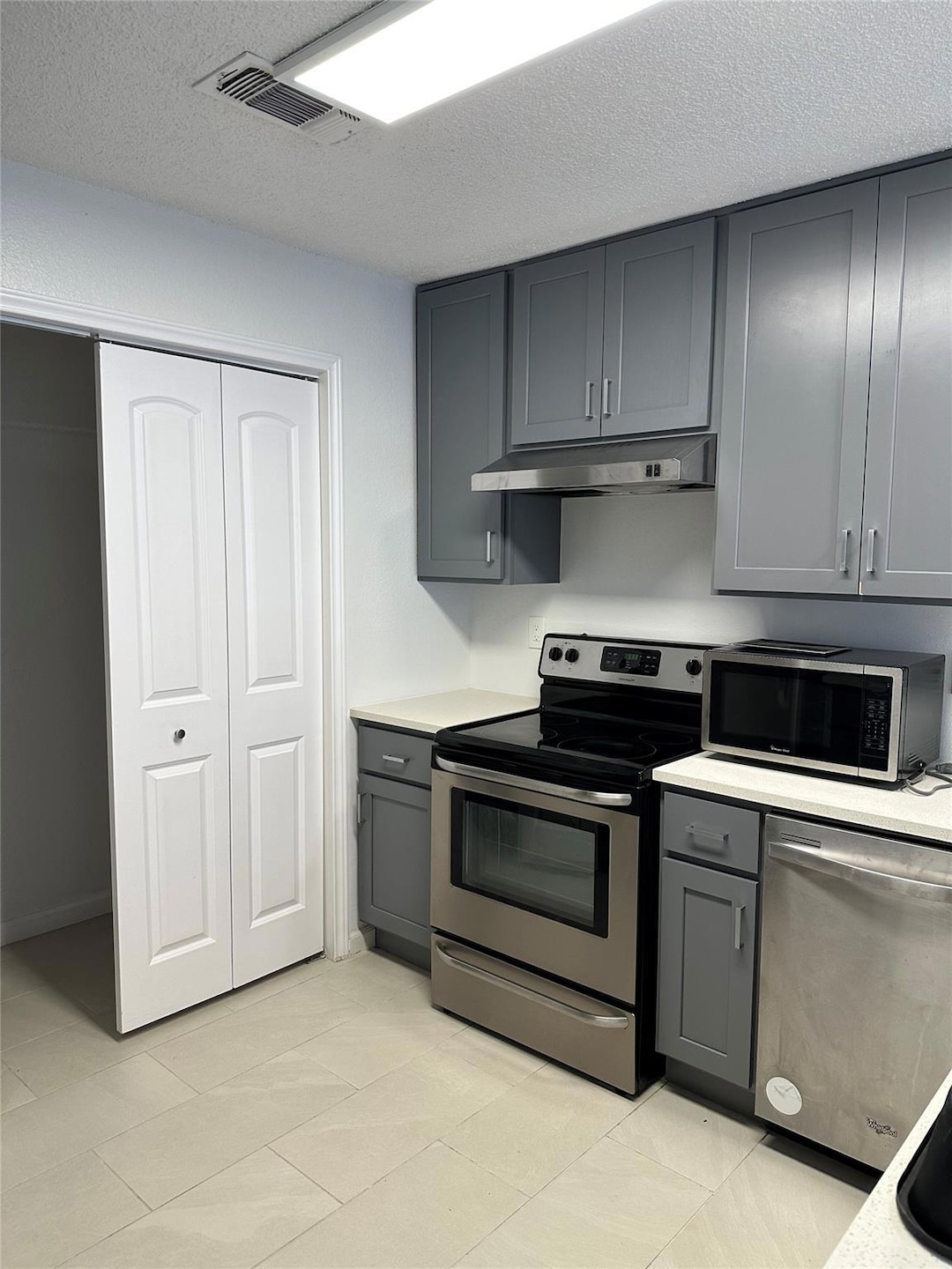 Kitchen featuring appliances with stainless steel