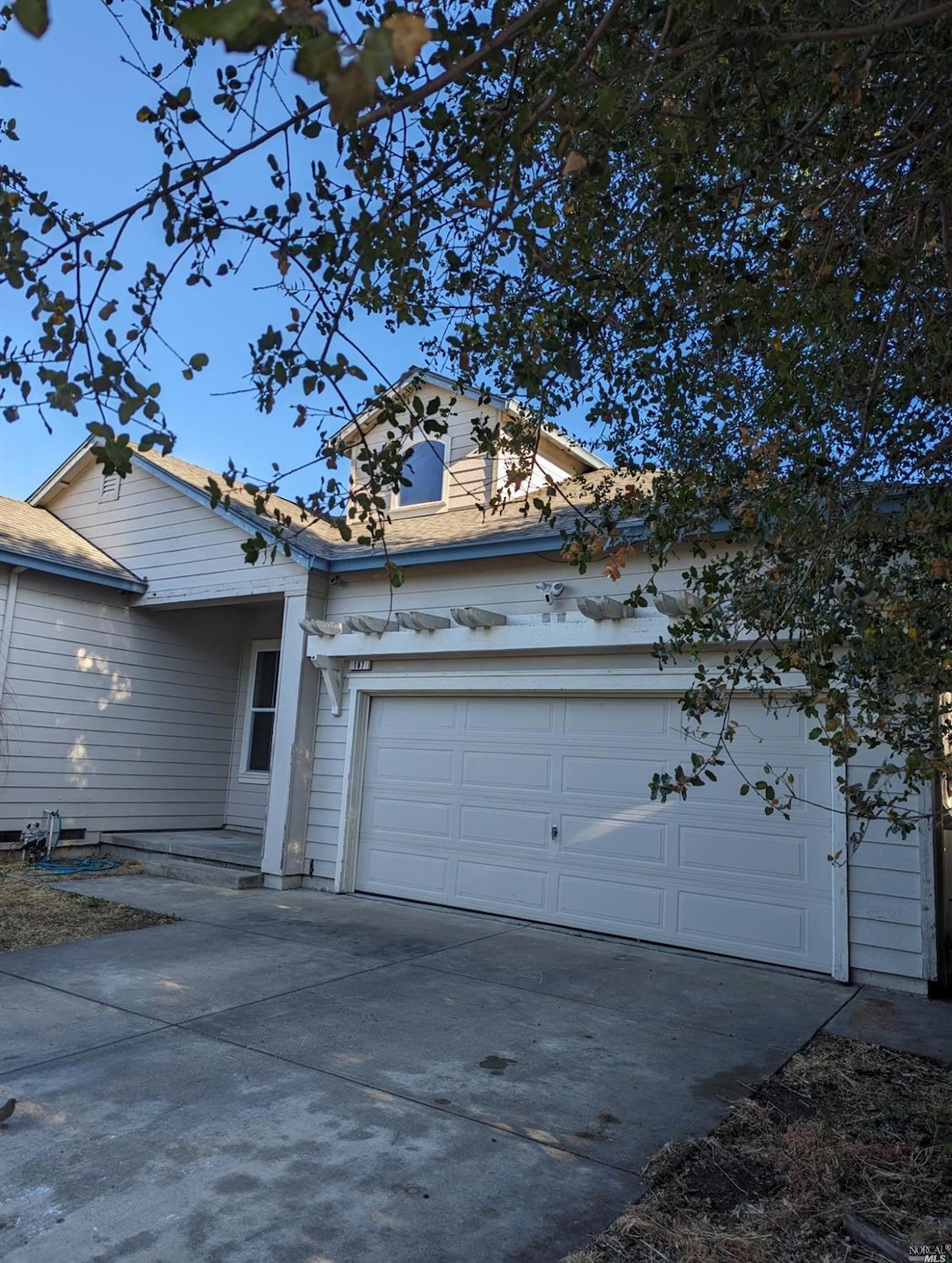 2 car garage, wide driveway off of a private lane.