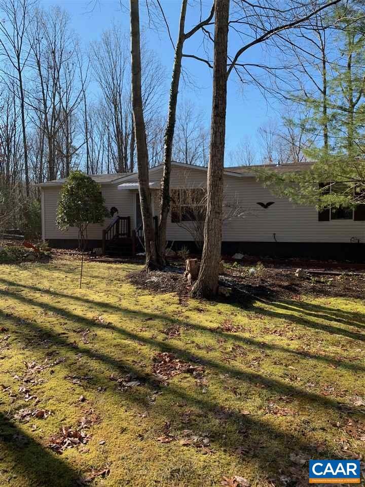Wooded setting near pond