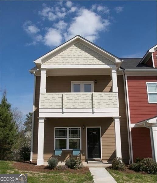 View of front of property featuring a balcony